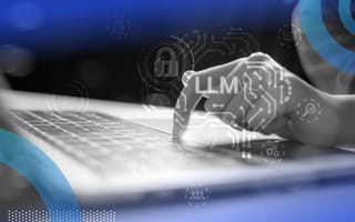 A hand types on a laptop with a superimposed LLM symbol