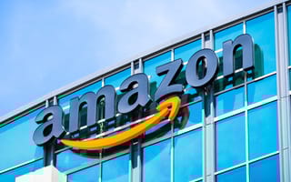 An exterior photo of an Amazon office building is shown.